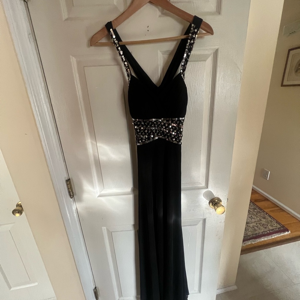 I am selling a black sequined size 3 prom dress for $60.